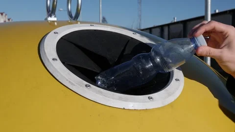 Care for the environment .Hand throws away a plastic bottle . Stock Footage 305762974