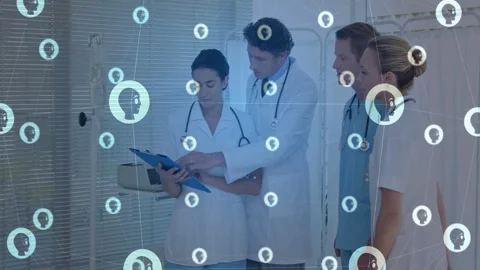 Care team opening blue chart by bed, reviewing notes, planning care while icons Stock Footage 333078064