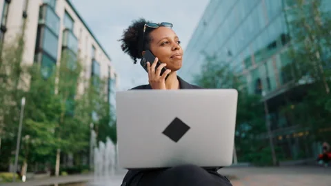 Career and online work, young adult black lady calling by mobile phone for job. Stock Footage 344390450