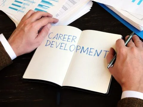 Career Development written by man on the sheet. Stock Photos