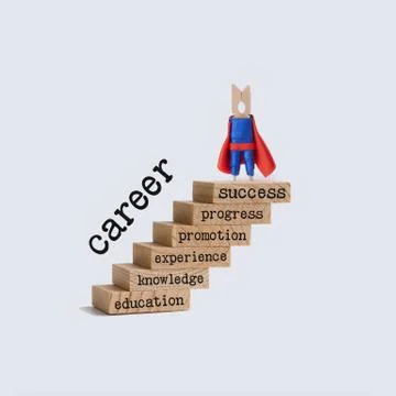 Career ladder growth concept. Superhero character on top of the wooden steps Stock Photos