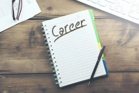 Career : text inside notebook and keyboard Stock Photos