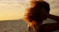 Carefree Happy Woman Laughing in Sunset and Playing with Her Curly Hair. Slow HD Footage