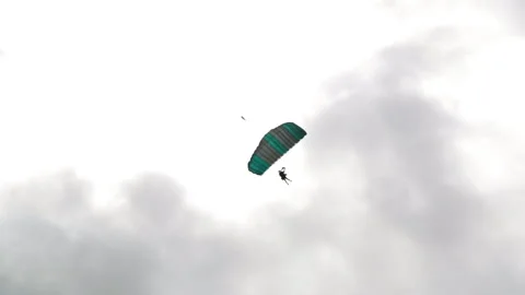 Carefree Person Having Fun While Paragliding During Vacation Against Cloudy Sky Stock Footage 154609974