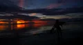 Carefree Woman Dancing in the Sunset on the Beach. Slow Motion. HD Footage