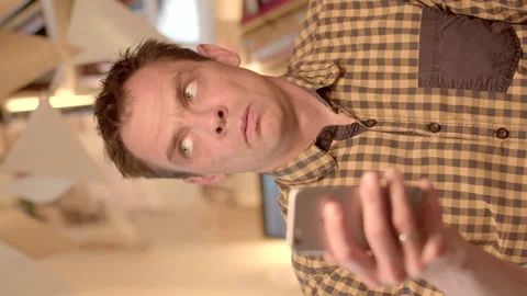 Careful analysis of information from the smartphone screen. He reads the text Stock Footage 278222188