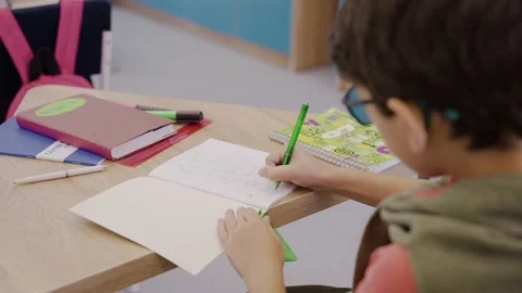 Careful boy drawing in geometry lesson with ruler and pencil, elementary school Video stock 162737485
