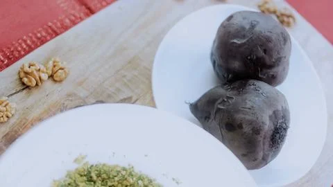 Careful cooking process view: combining beetroot with herbs and spices Stock Photos