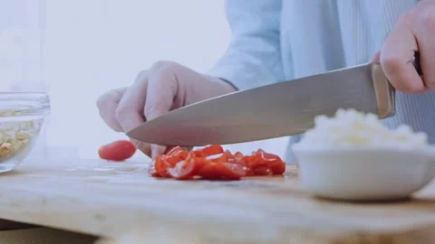 Careful finished meal angle: adding walnuts and spices to the sauce Stock Footage 342200968