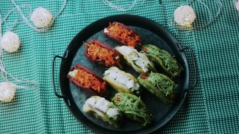 Careful ingredient study: showing assorted loaded lettuce wraps on a black Foto stock