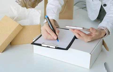 Careful Packaging: Expert Hands Ensuring Secure Shipping for Online Store P.. Stock Photos