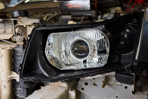 Careful precision is essential when installing a car headlight assembly for Stock Photos
