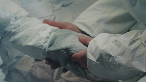 Careful transfer in protective gear. Experts in protective suits precisely Stock Footage 346476033
