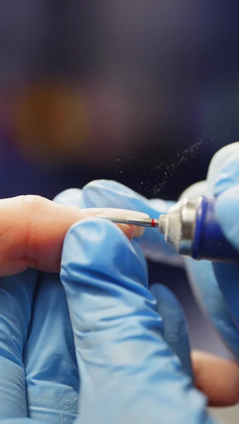Careful work with an electric manicure machine on the skin. Video stock 343534490