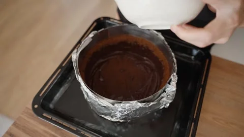 Carefully Adding More Chocolate Mixture to the Crust, Building Up the Layer. The Stock Footage 280089955