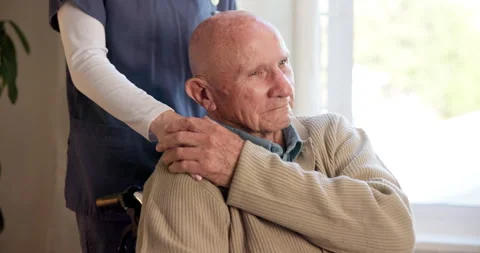 Caregiver, holding hands and support for old man in wheelchair, senior care and Stock Footage 340609070