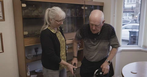 Caregiver, senior and man with walker in an old age retirement home disabled in Stock-Footage 308037814