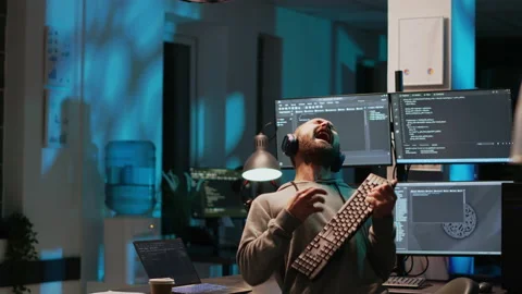 Careless html coder playing air guitar with keyboard Stock Footage 224577846