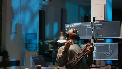 Careless html coder playing air guitar with keyboard Stock Photos