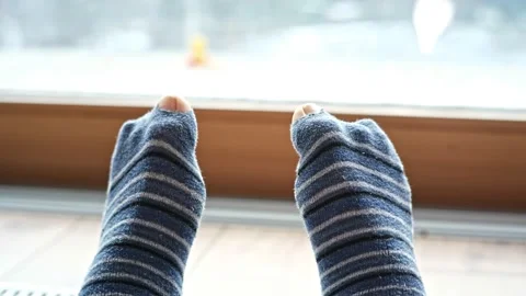 Young girl wearing toe socks hi-res stock photography and images