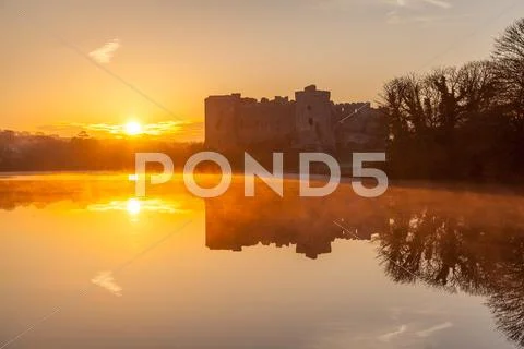 Carew Castle sunrise, Pembrokeshire, Wales, United Kingdom, Europe Stock Photos