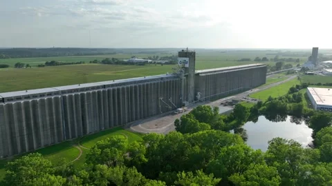 Cargill grain elevator in Topeka, Kansas, with vast green fields in the Stock Footage 254580576