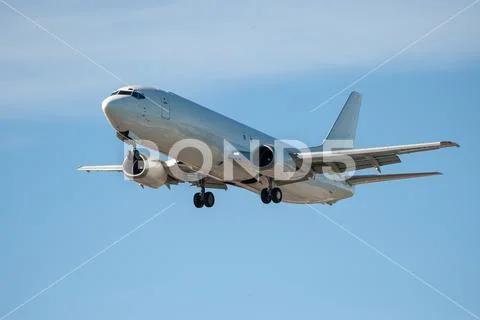 Cargo aircraft landing on a runway Stock Photos