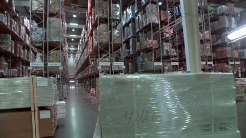 Cargo and goods on the shelves of a large warehouse Stock Footage 105990096