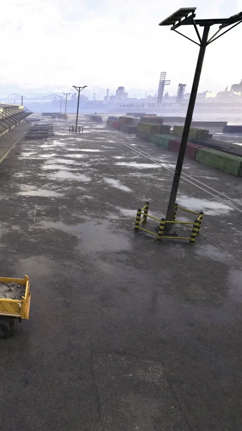 Cargo area shows wet ground with containers and empty trolley at port Stock Footage 331682869