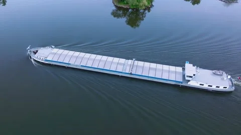 Cargo barge floats on the river Stock Footage 194730827