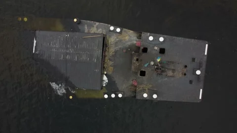 Cargo barge, lies at the bottom of the river. copter flies over a sunken ship. Stock Footage 149894136