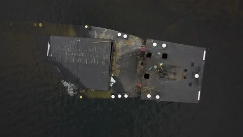 Cargo barge, lies at the bottom of the river. copter flies over a sunken ship. Stock Footage 149894164