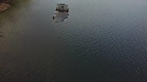 Cargo barge, lies at the bottom of the river. copter flies over a sunken ship. Stockbeeldmateriaal 149894569