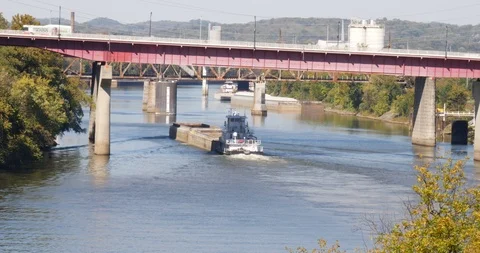 Cargo barge passing under bridges Stock Footage 89029548