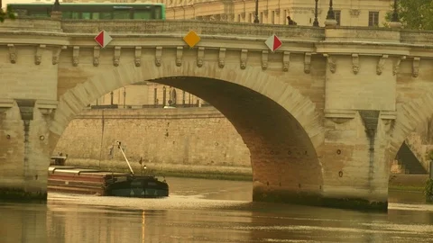 Cargo barge passing under the Pont Neuf in Paris Stock Footage 112128443