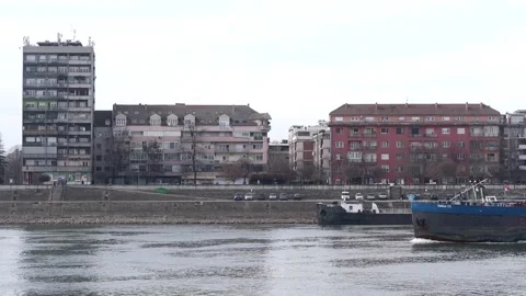 Cargo barge sailing along the Podbara district on the Danube Video stock 328660254