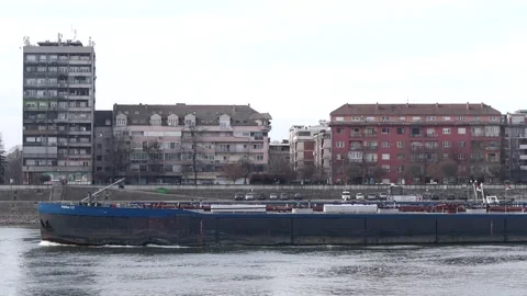 Cargo barge sailing along the Podbara district on the Danube Video stock 328660279