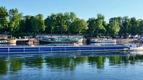 Cargo barge sailing on Seine river in Paris, France Stock Footage 336940181