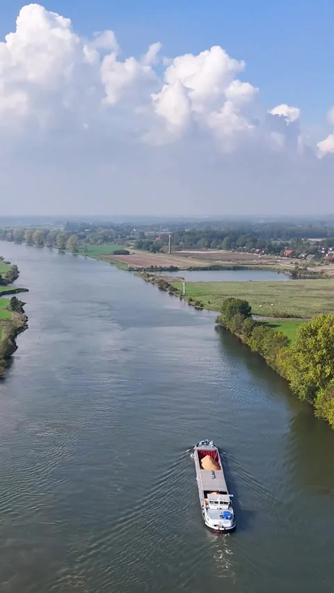 Cargo barge transporting goods on a river Video stock 327108620