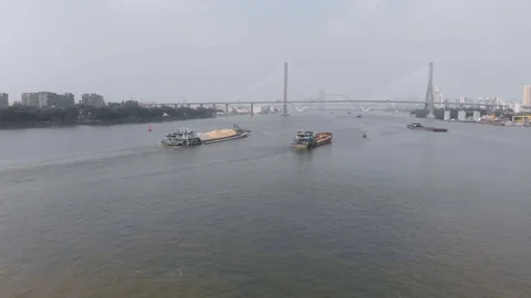 Cargo barges with building materials sail on the river. Stock Footage 118036734
