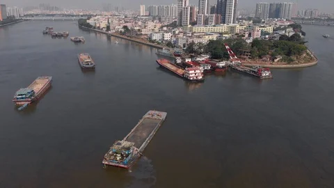Cargo barges pollute a river in a big city. Stock Footage 118243145