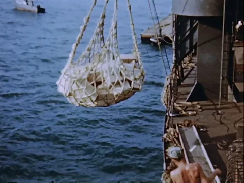 Cargo being transported to barge from ship - 1946 Stock Footage 94450667