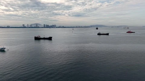 Cargo Boat Fleet Floating Calm Sea Near City Skyline Under Cloudy Sky Stock Footage 336948324