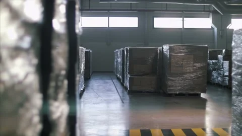 Cargo boxes in large  supply chain factory warehouse, ready to be exported. Stock Footage 157397340