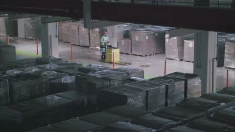 Cargo boxes in large  supply chain factory warehouse, ready to be exported. Stock-Footage 157397343