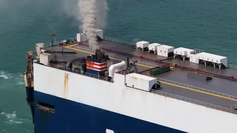 Cargo car carrier ship emitting smoke at sea Stock Footage 329557210