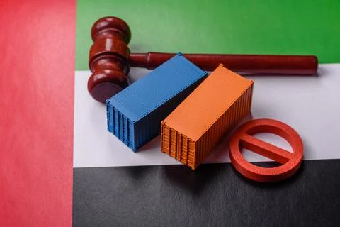 The cargo container ban on the UAE flag as a conceptual backdrop. The cargo.. Stock Photos