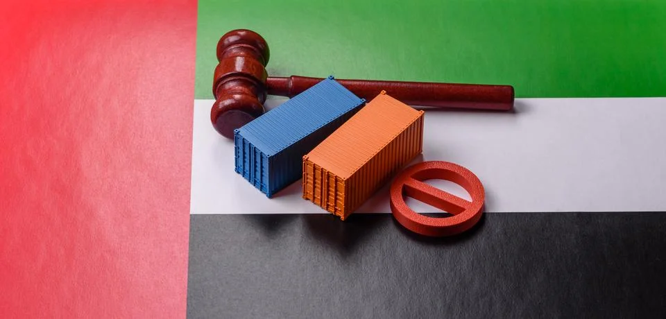 The cargo container ban on the UAE flag as a conceptual backdrop. The cargo.. Stock Photos