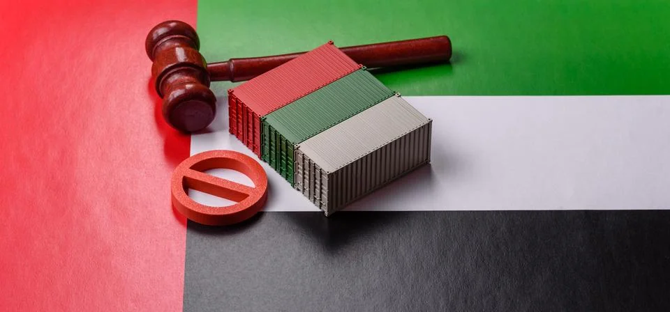 The cargo container ban on the UAE flag as a conceptual backdrop. The cargo.. Stock Photos