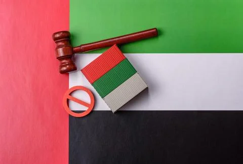 The cargo container ban on the UAE flag as a conceptual backdrop. The cargo.. Stock Photos